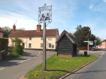 Bramfield Village Sign with the Queens Head Pub behind