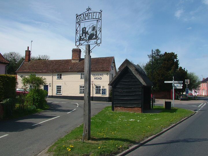 Village centre, at Bramfield crossroads, with village sign, thatched bus shelter and the notable award-winning Queen's Head public house - and a peaceful Suffolk afternoon. 